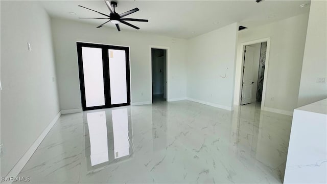 2503 46th St SW, Lehigh Acres, FL 33976 - empty room featuring light marble finish floors, ceiling fan, and a smoke detector