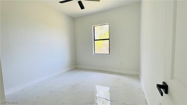 2503 46th St SW, Lehigh Acres, FL 33976 - unfurnished room featuring ceiling fan and marble finish floors