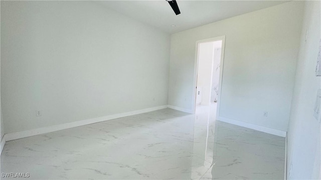2503 46th St SW, Lehigh Acres, FL 33976 - spare room featuring light marble finish floors and ceiling fan
