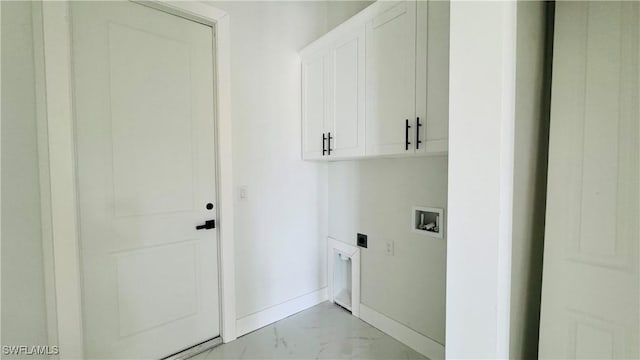 2503 46th St SW, Lehigh Acres, FL 33976 - laundry room with hookup for an electric dryer, cabinet space, hookup for a washing machine, and light marble finish floors