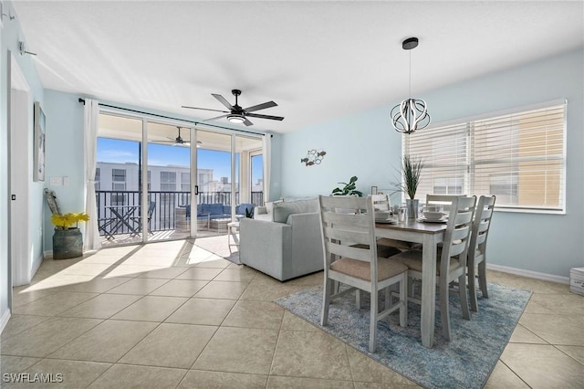4411 Bay Beach Ln Unit 744, Fort Myers Beach, FL 33931 - dining room with light tile patterned floors and ceiling fan