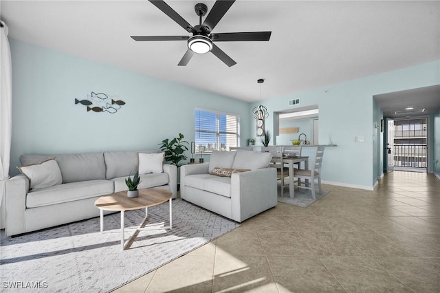 4411 Bay Beach Ln Unit 744, Fort Myers Beach, FL 33931 - living area with healthy amount of natural light, ceiling fan, and tile patterned flooring