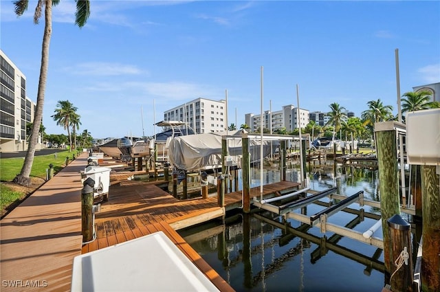 4411 Bay Beach Ln Unit 744, Fort Myers Beach, FL 33931 - dock area with boat lift and a water view