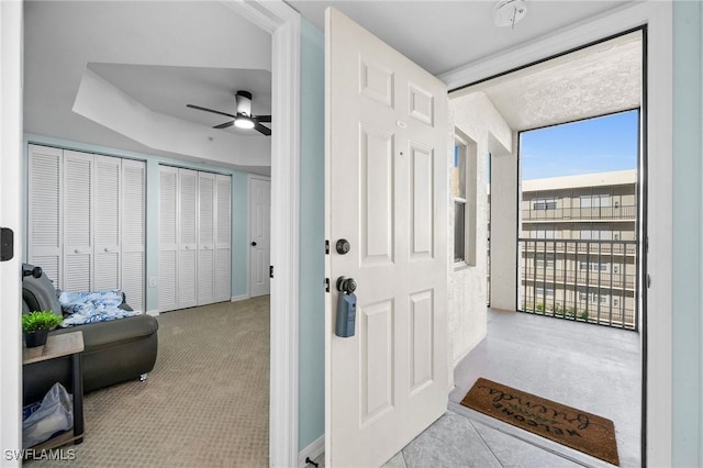 4411 Bay Beach Ln Unit 744, Fort Myers Beach, FL 33931 - foyer entrance with a ceiling fan and carpet flooring