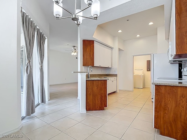 9260 Belleza Way Unit 203, Fort Myers, FL 33908 - kitchen featuring light tile patterned flooring, decorative backsplash, a chandelier, white cabinetry, and recessed lighting