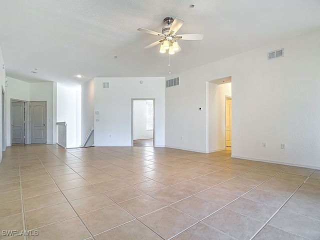 9260 Belleza Way Unit 203, Fort Myers, FL 33908 - unfurnished room featuring light tile patterned floors and ceiling fan