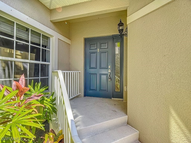 9260 Belleza Way Unit 203, Fort Myers, FL 33908 - doorway to property with stucco siding