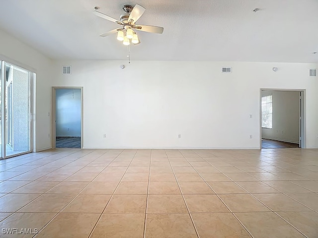 9260 Belleza Way Unit 203, Fort Myers, FL 33908 - empty room with ceiling fan and light tile patterned flooring