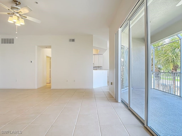 9260 Belleza Way Unit 203, Fort Myers, FL 33908 - unfurnished room featuring light tile patterned floors and ceiling fan