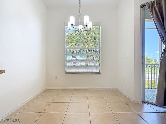 9260 Belleza Way Unit 203, Fort Myers, FL 33908 - unfurnished dining area with a chandelier and light tile patterned floors
