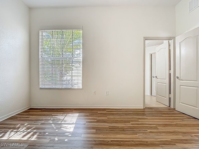 9260 Belleza Way Unit 203, Fort Myers, FL 33908 - spare room featuring light wood-style flooring and baseboards