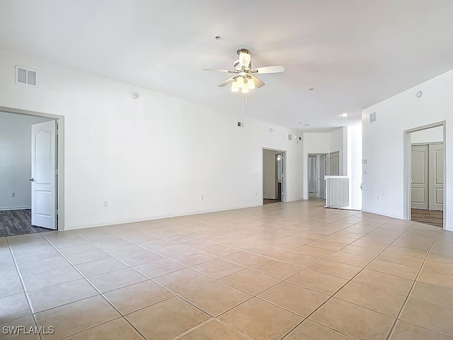 9260 Belleza Way Unit 203, Fort Myers, FL 33908 - unfurnished room featuring light tile patterned flooring and a ceiling fan
