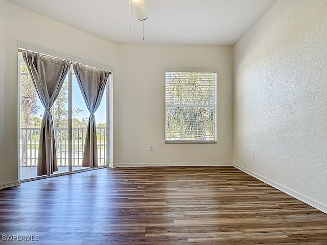9260 Belleza Way Unit 203, Fort Myers, FL 33908 - empty room featuring wood finished floors and ceiling fan