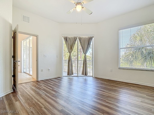 9260 Belleza Way Unit 203, Fort Myers, FL 33908 - spare room featuring ceiling fan and wood finished floors