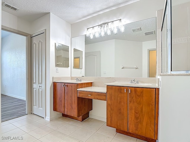9260 Belleza Way Unit 203, Fort Myers, FL 33908 - full bathroom with vanity, a textured ceiling, and tile patterned floors