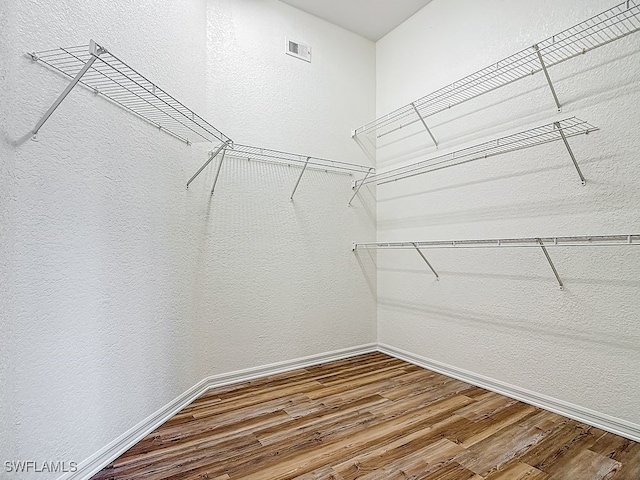 9260 Belleza Way Unit 203, Fort Myers, FL 33908 - spacious closet with wood finished floors