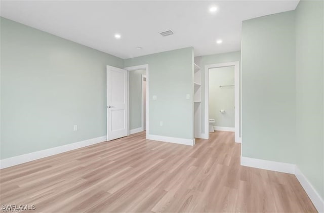 407 Meadowlark Ln Unit 407B, Naples, FL 34105 - unfurnished room featuring light wood-style flooring and recessed lighting