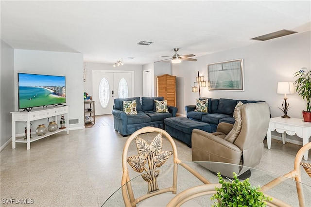211 W Flamingo Cir, Marco Island, FL 34145 - living area featuring speckle patterned floor and a ceiling fan
