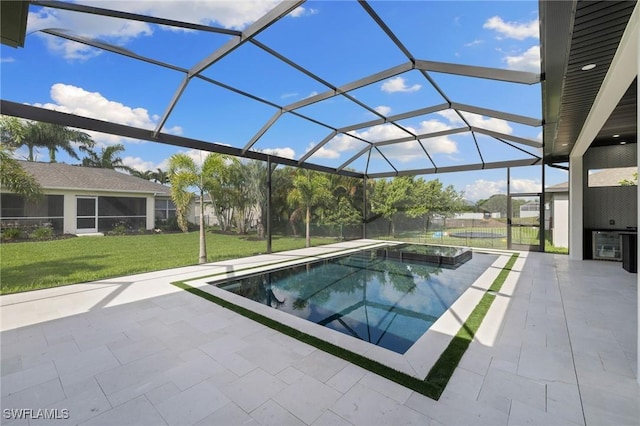 3620 SW 4th Ln, Cape Coral, FL 33991 - view of pool featuring a yard, a patio, a pool with connected hot tub, and glass enclosure