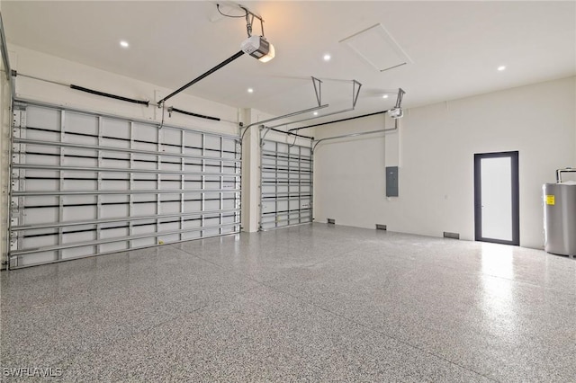 3620 SW 4th Ln, Cape Coral, FL 33991 - garage featuring water heater, electric panel, and a garage door opener