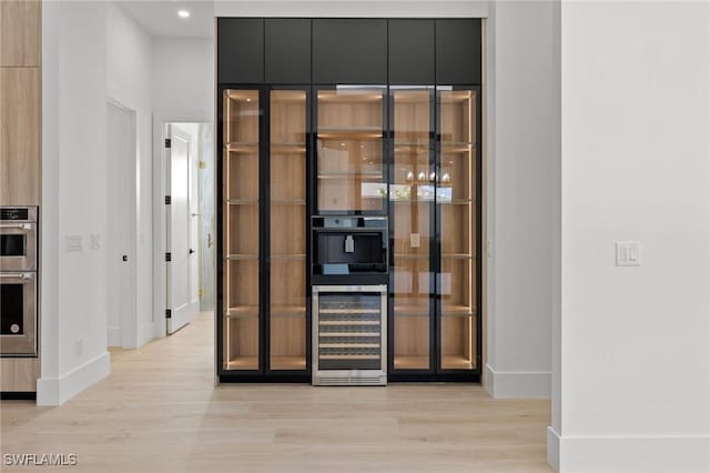 3620 SW 4th Ln, Cape Coral, FL 33991 - wine cellar featuring beverage cooler, light wood-style floors, and recessed lighting