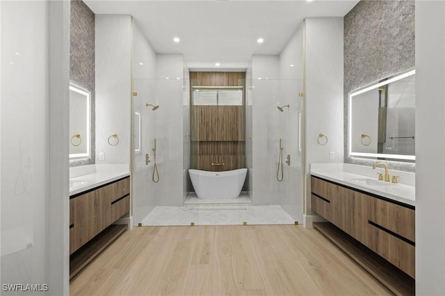 3620 SW 4th Ln, Cape Coral, FL 33991 - full bath with a shower stall, wood finished floors, a freestanding tub, and two vanities