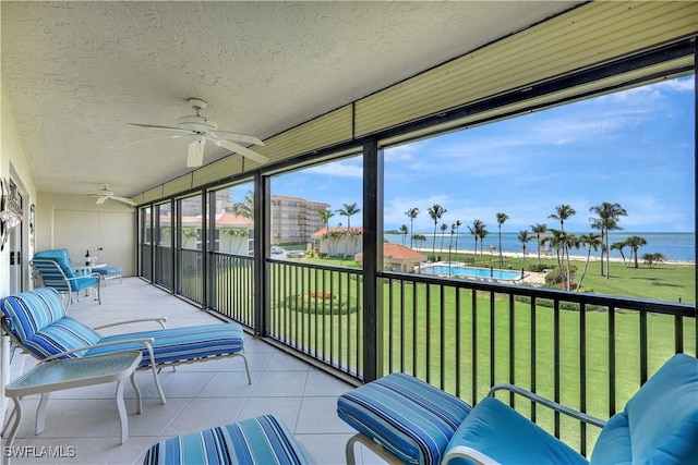 1080 S Collier Blvd Unit 305, Marco Island, FL 34145 - sunroom / solarium with ceiling fan and a water view