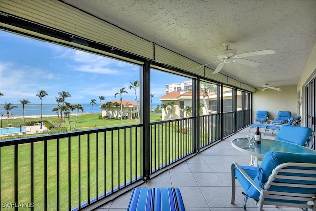 1080 S Collier Blvd Unit 305, Marco Island, FL 34145 - sunroom / solarium with a water view and a ceiling fan