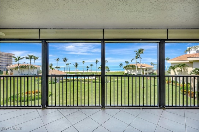 1080 S Collier Blvd Unit 305, Marco Island, FL 34145 - unfurnished sunroom featuring a water view