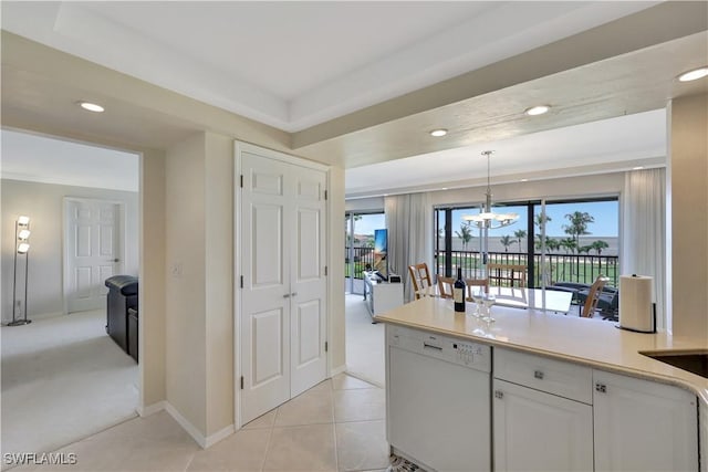 1080 S Collier Blvd Unit 305, Marco Island, FL 34145 - kitchen featuring white dishwasher, white cabinetry, recessed lighting, a chandelier, and pendant lighting