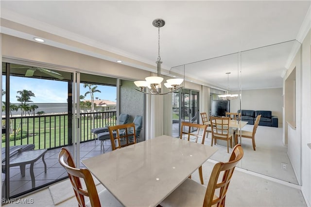 1080 S Collier Blvd Unit 305, Marco Island, FL 34145 - dining space with a chandelier, a water view, recessed lighting, and ornamental molding