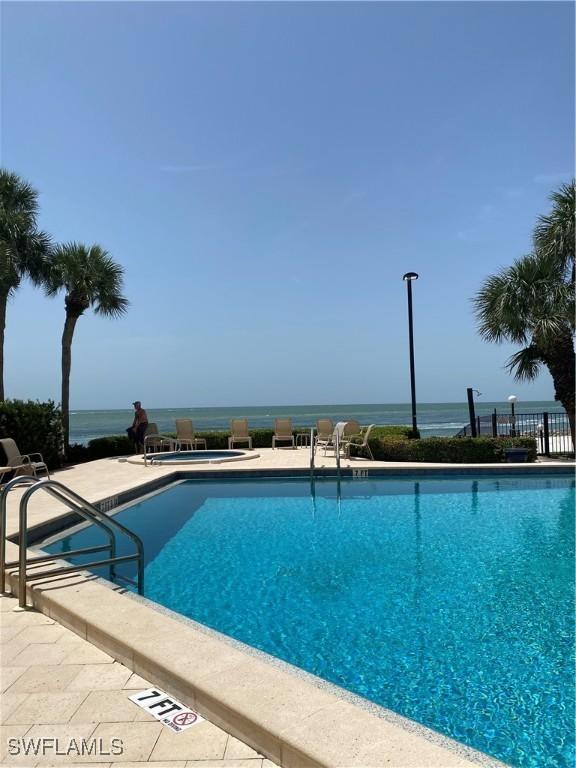 1080 S Collier Blvd Unit 305, Marco Island, FL 34145 - community pool featuring a patio
