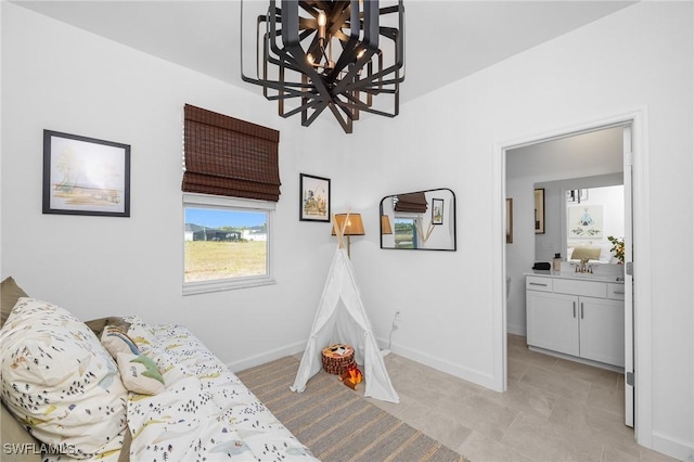 17752 Saddleback Loop, North Fort Myers, FL 33917 - bedroom featuring a chandelier and light tile patterned floors