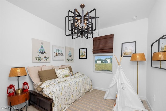 17752 Saddleback Loop, North Fort Myers, FL 33917 - bedroom with a chandelier and baseboards