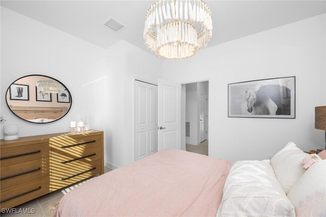 17752 Saddleback Loop, North Fort Myers, FL 33917 - tiled bedroom featuring a chandelier and a closet