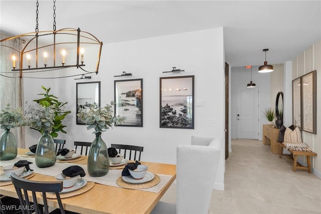 17752 Saddleback Loop, North Fort Myers, FL 33917 - dining space featuring a chandelier and baseboards