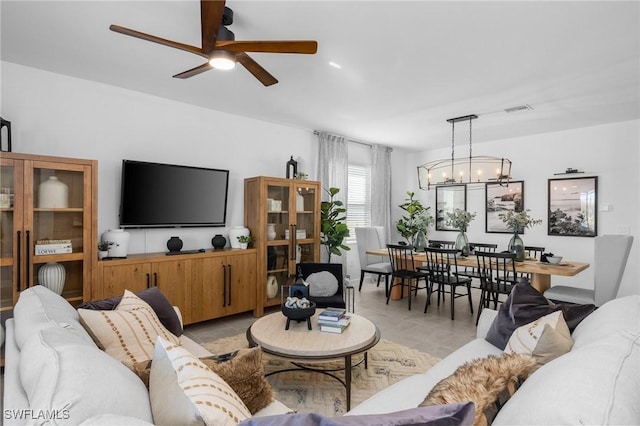 17752 Saddleback Loop, North Fort Myers, FL 33917 - living area with ceiling fan, light tile patterned floors, and a chandelier