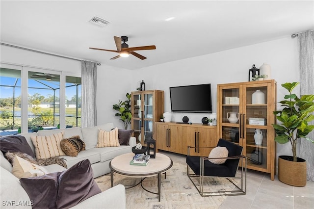17752 Saddleback Loop, North Fort Myers, FL 33917 - living area with a ceiling fan and light tile patterned floors