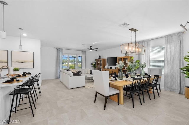 17752 Saddleback Loop, North Fort Myers, FL 33917 - dining space featuring ceiling fan and a chandelier