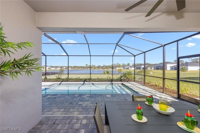 17752 Saddleback Loop, North Fort Myers, FL 33917 - outdoor pool featuring a lanai, a water view, a patio, and a ceiling fan