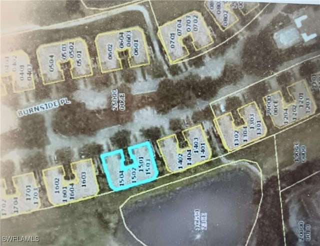20250 Burnside Pl Unit 1502, Estero, FL 33928 - aerial overview of property's location featuring property parcel outlined