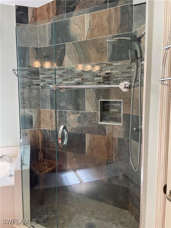 20250 Burnside Pl Unit 1502, Estero, FL 33928 - bathroom featuring a stall shower