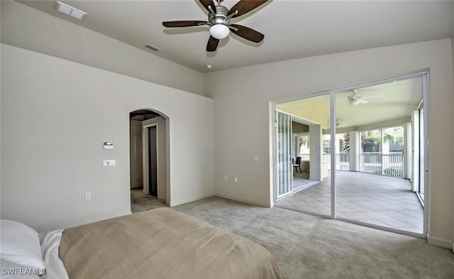 20250 Burnside Pl Unit 1502, Estero, FL 33928 - unfurnished bedroom with arched walkways, carpet flooring, access to outside, ceiling fan, and lofted ceiling