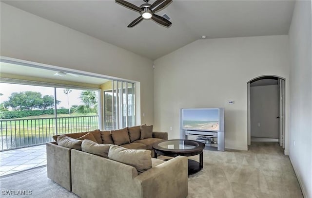 20250 Burnside Pl Unit 1502, Estero, FL 33928 - living area featuring a ceiling fan, light colored carpet, lofted ceiling, and arched walkways