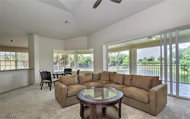 20250 Burnside Pl Unit 1502, Estero, FL 33928 - living room with ceiling fan, light colored carpet, a water view, and vaulted ceiling