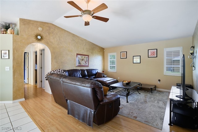 17139 Knight Dr, Fort Myers, FL 33967 - living room featuring ceiling fan, arched walkways, vaulted ceiling, and light wood-style floors
