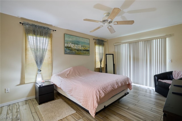 17139 Knight Dr, Fort Myers, FL 33967 - bedroom with multiple windows, wood finished floors, and a ceiling fan