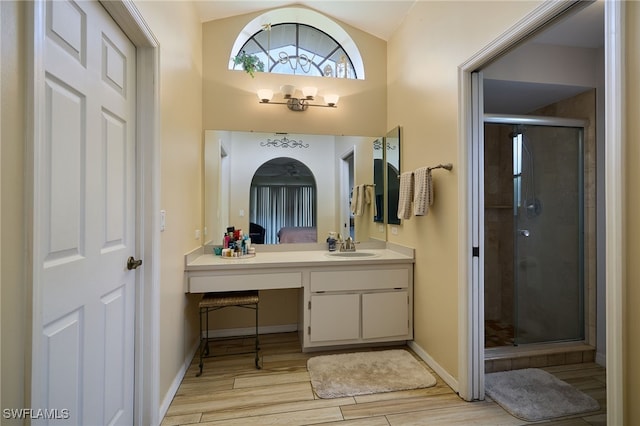 17139 Knight Dr, Fort Myers, FL 33967 - ensuite bathroom featuring vanity, wood finished floors, a shower stall, and lofted ceiling