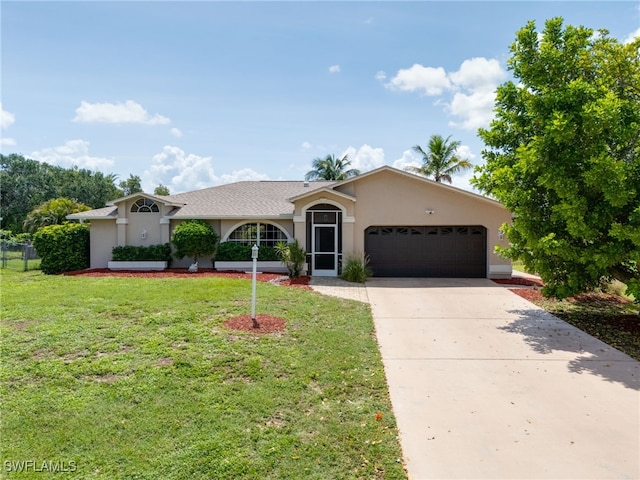 17139 Knight Dr, Fort Myers, FL 33967 - ranch-style home with an attached garage, stucco siding, a front lawn, and driveway