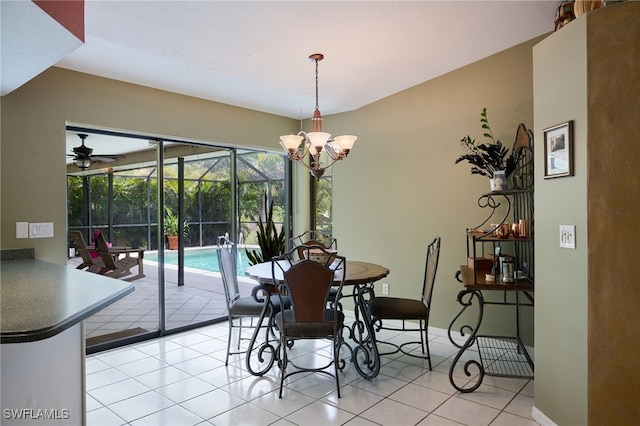 17139 Knight Dr, Fort Myers, FL 33967 - dining area featuring light tile patterned flooring, a sunroom, a chandelier, and a ceiling fan